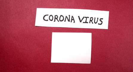 Note COVID-19 /coronavirus on white paper on the red background. Economy and financial markets affected by corona virus. flat lay, Space for text.
