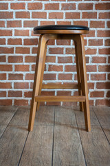 Wooden chairs or stools vintage with the old brick wall interior retro style decoration