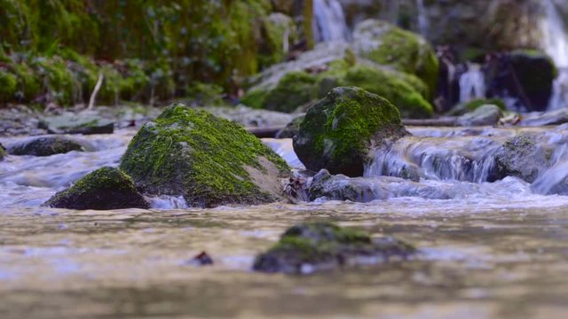 gorge in solothurn with beautiful waterfalls and moss-covered rocks