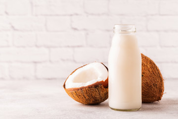 A bottle of coconut milk and coconut