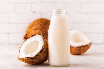 A bottle of coconut milk and coconut
