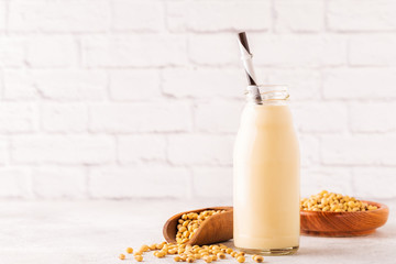 A bottle of soy milk and soy beans