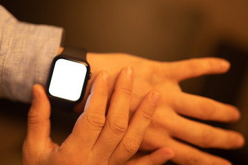 Close up of Businessman's hand looking at hand watch