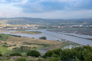 Views of the Saja River, from the west bank, just at the point where it flows into the Ría de San Martín de la Arena, at high tide