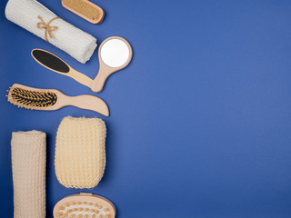 Hygienic accessories for body care on the blue background.