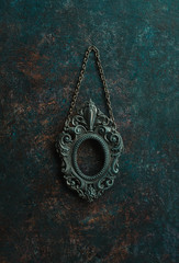 Metal oval frame on a wall