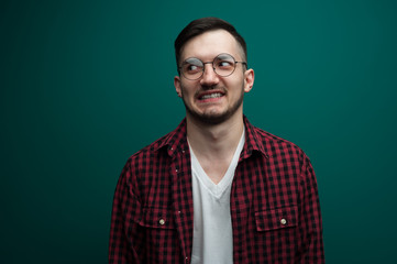 Obraz premium Portrait of a funny young interested man