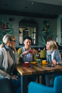 woman friends on coffee break at cafe