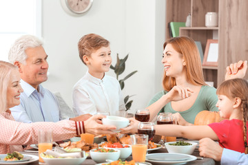 Family celebrating Thanksgiving Day at home