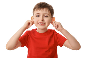 Funny grimacing little boy on white background