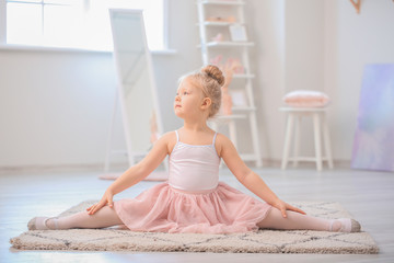 Cute little ballerina at home