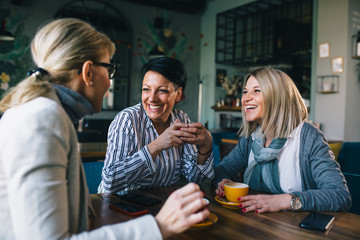 woman friends on coffee break at cafe