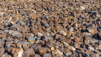 Large area of brown rocks on the graound