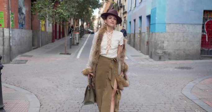 confident strong independent lady girl woman in retro walks the street happy smiling