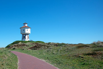 Fototapeta na wymiar Poster, Wasserturm auf der Nordseeinsel Langeeoog, Bild_01