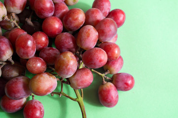 grape bunch close up, fresh fruit photo. green background