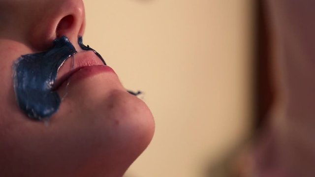 Sugar hair removal from woman body. Wax epilation spa procedure. Procedure beautician female. Mustache.