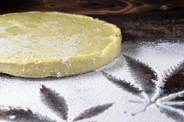 Next to flour with traces of cannabis is a piece of hash oil