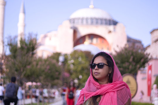  girl with pink burca and glasses