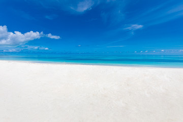 Fototapeta na wymiar White sand beach and blue sky. Sea sand sky concept. Tropical landscape pattern, horizon and endless sea view as seascape