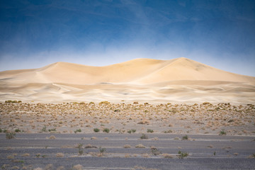 Dunes of Death Valley desert at sunrise.