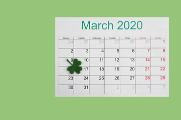 March 17th Irish holiday Patrick's Day. The date is marked on the wall calendar.