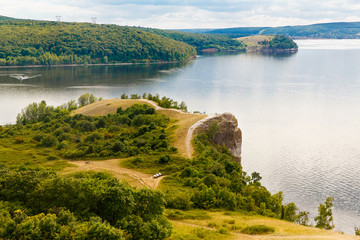 Aerial view from the drone of landscape Volga river flows among the hills and fields. The middle band of Russia.