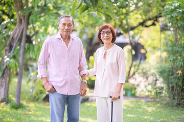 Asian elderly couple together in the park.Retirement happy  lifestyle concept