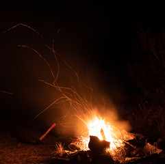 Burning night bonfire in the mountains.