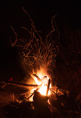 Burning night bonfire in the mountains.