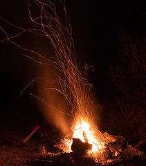 Burning night bonfire in the mountains.