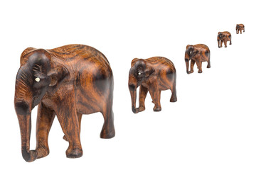 Wooden carved elephant on a white background