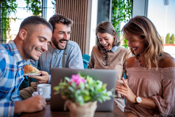 Young people browsing internet in a restaurant