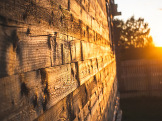 sunlight on the wall of a wooden house, Russia