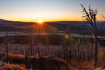The rays of the sun at dawn in the mountains