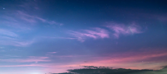 Obraz na płótnie Canvas Starry cloudy twilight sky at dusk