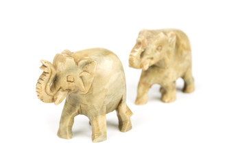 Carved marble elephant on a white background