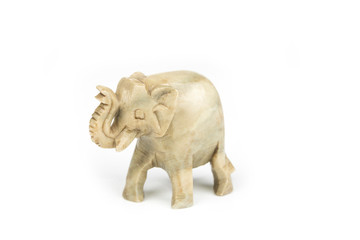 Fototapeta na wymiar Carved marble elephant on a white background