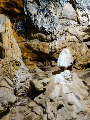 stalactites and stalagmites grew in a large cave in the mountains