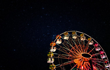 Ferris wheel on a background of the starry night sky