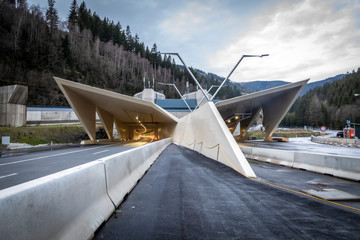 illuminated freeway tunnel portal on highway A9 named gleinalmtunnel in styria, austria