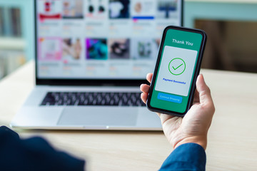 using smartphone and laptop online shopping