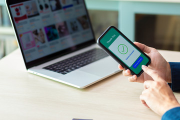 using smartphone and laptop online shopping