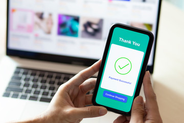 using smartphone and laptop online shopping