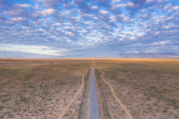 Fototapeta na wymiar Aerial view of desert road in Mojave California
