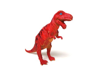 Red tyrannosaurus rex isolated on white background. Miniature of dinosaur toy. Kids toy. Red rubber toy.