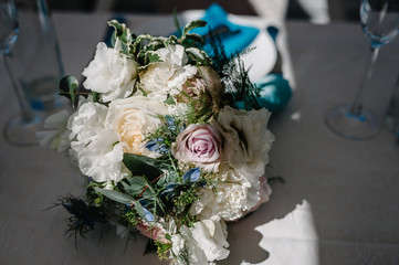 Beautiful bouquet of flowers and greenery ready for the big wedding ceremony, bridal bouquet. Decoration made of roses, peonies and decorative plants, selective focus, nobody, objects. Close up.