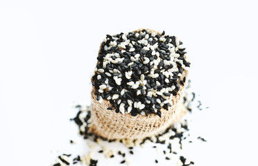 sesame seeds on white fabric background