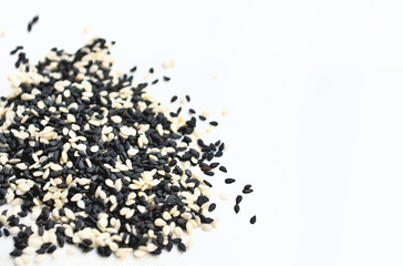 sesame seeds on white fabric background