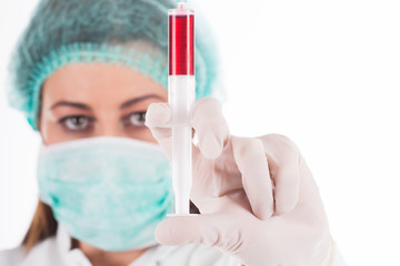 Woman doctor wearing a medical protective mask against coronavirus